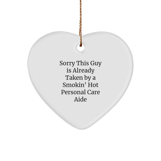 Funny Gift for Personal Care Aide, Heart Ornament 'Sorry This Guy Is Already Taken By A Smokin' Hot Personal Care Aide', Gifts from Men to Personal Care Aide, Christmas Unique Gifts for Her - Image 1