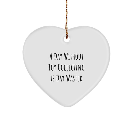 Funny Toy Collecting Gifts from Friends and Family, 'A Day Without Toy Collecting Is Day Wasted' Heart Ornament for Men, Women, and Children, Unique Christmas Decorations - Image 1