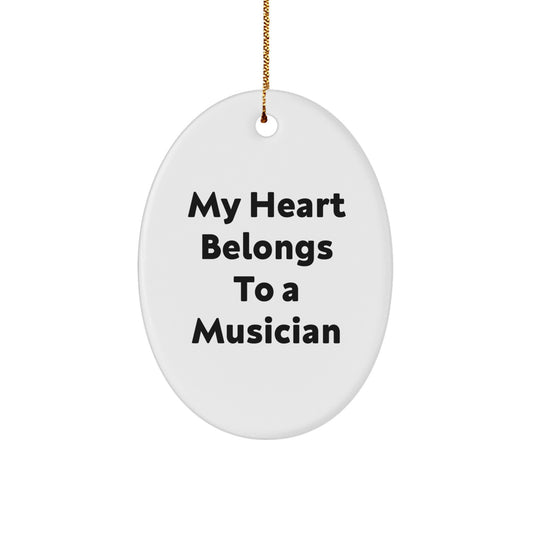Funny Musician Gifts from Friends - Oval Ornament for Music Lovers with Quote 'My Heart Belongs To A Musician' - White, 3.25" Tall, for Christmas - Image 1