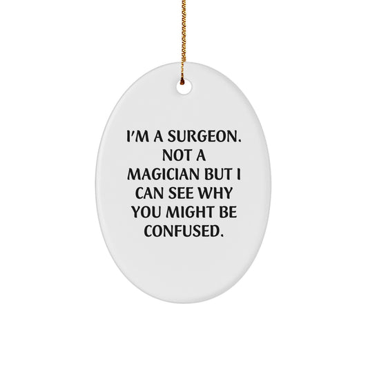 Funny Surgeon Gifts - I'm A Surgeon, Not A Magician, Oval Ornament for Christmas, Gifts from Men to Surgeon Friends - Image 1