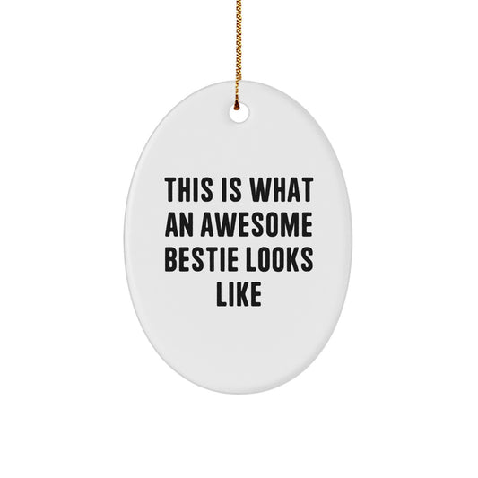 Funny Bestie Gifts from Friends for Christmas - This Is What An Awesome Bestie Looks Like Oval Ornament, White, 3.25" Tall, Durable MDF, High-Gloss Plastic Finish, Easy Hanging - Image 1